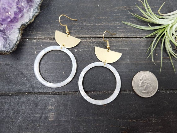 White and gold statement earrings deals