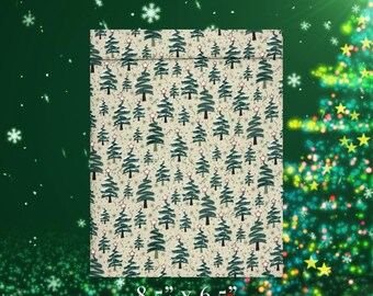 May include: A rectangular gift bag with a festive Christmas tree pattern. The bag is 8.5 inches by 6.5 inches and features a repeating design of green Christmas trees with star toppers and small red accents on a cream background.