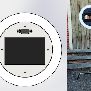 May include: A white ring light with a black screen displaying the text "La Moda Photography" mounted on a silver tripod stand.