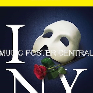 May include: A white mask with a black eye hole and a red rose on a blue background with the letters I, N, and Y in white. The text "PLAYBILL" is in black on a yellow background. The text "MAJESTIC THEATRE" is in black below the word "PLAYBILL". The text "MUSIC POSTER CENTRAL" is in white on a black background.