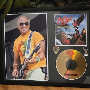 Jimmy Buffett Glass Framed Rock Piece with Color Photo, Gold CD, Limited Edition Guitar Pick and pop Top