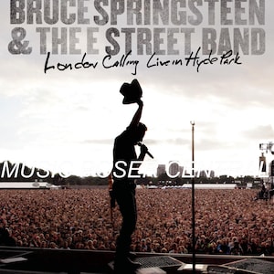 May include: DVD cover for Bruce Springsteen & The E Street Band's "London Calling Live in Hyde Park." The image shows a silhouette of Springsteen on stage, holding a hat, with a large crowd in the background. Text includes the band's name and album title.
