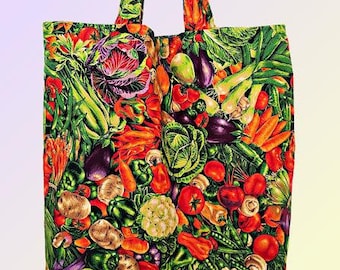 May include: A reusable tote bag with a colorful print of various vegetables, including tomatoes, peppers, onions, and carrots. The bag has a green, red, and yellow color scheme.