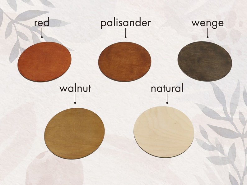 May include: Five round wooden discs in different wood stains: red, palisander, wenge, walnut, and natural.