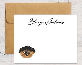 May include: White stationery card with a black and brown dog illustration and the text "Stacy Andrews" at the top.