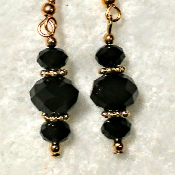 Dressy black faceted glass beads with gold colored spacers and beads
