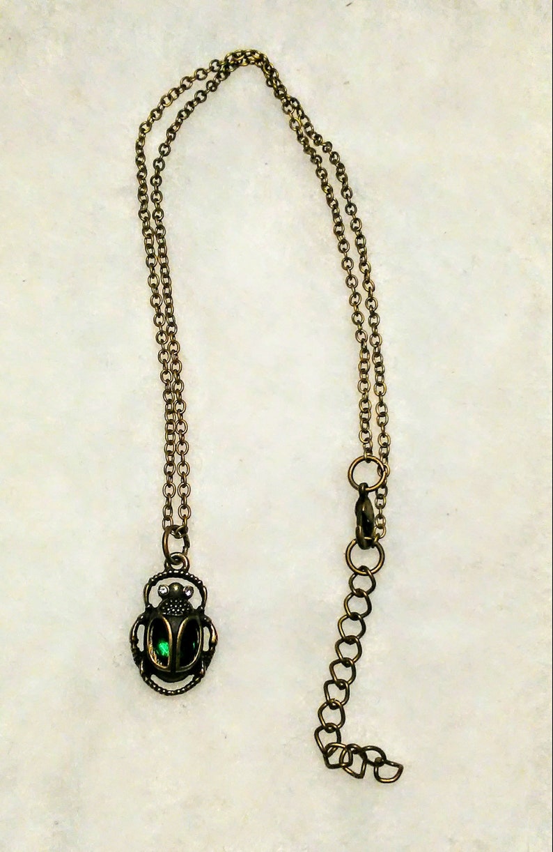 Egyptian scarab beetle in antique gold with a dark emerald green glass body necklace fantasy myths medieval beautiful Egypt treasures moms