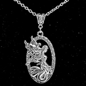 Fairy in an ornate ring pendant necklace