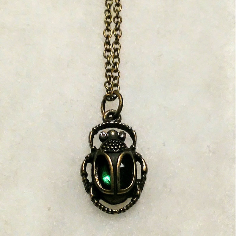 Egyptian scarab beetle in antique gold with a dark emerald green glass body necklace fantasy myths medieval beautiful Egypt treasures moms