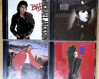 May include: Four compact discs, each with a different album cover. The first album is "Bad" by Michael Jackson, the second is "Rhythm Nation 1814" by Janet Jackson, the third is "Freddie Jackson" by Freddie Jackson, and the fourth is "Control" by Janet Jackson.