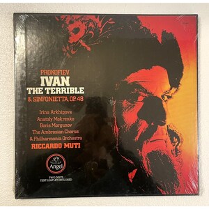 May include: A vinyl record album featuring Prokofiev's "Ivan the Terrible & Sinfonietta, Op. 48." The album cover has a red and black color scheme with a portrait of a man. The album includes the names of the performers and the label "Angel."