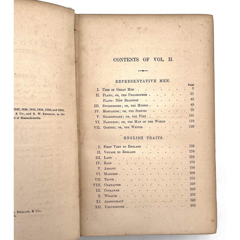 May include: Aged book pages displaying the "CONTENTS OF VOL II." with sections on "Representative Men" and "English Traits." The text is clearly visible, accompanied by page numbers, showing the book's contents.