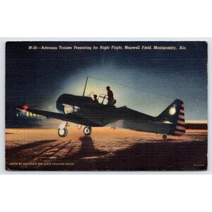 May include: Vintage postcard depicting an M-39 Advance Trainer preparing for a night flight at Maxwell Field, Montgomery, Ala. The image shows the silhouette of the plane against a dark sky, with two figures in the cockpit and a red light on the wing.