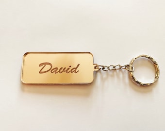 Personalized mirrored acrylic keychain.