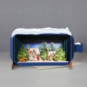 Kerstmis, sneeuwpoppen, huizen, bomen, sneeuwlandschap, lantaarnpalen, lasergesneden kaart, 3D-bericht in fles, pop-outkaart, 3D-cadeaubon, handgemaakte kaart, 3D, cadeaubon