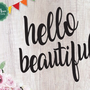 May include: A black and white graphic design with the text "hello beautiful" on a wood background with a garland of colorful flags.