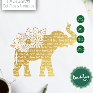 May include: A gold silhouette of an elephant with floral details. The elephant is standing on a white background. The image includes the text "Exclusive Cut Files & Printables" and "Birch Tree SVG".
