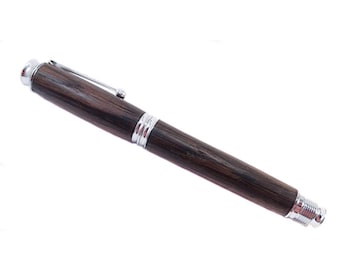 Personalized wooden fountain pen in Irish Bog Oak. Comes with a wooden pen box.