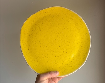Rounded 10.5” dinner plate with yellow glaze