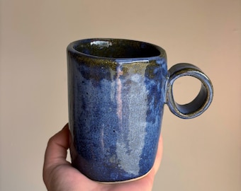 Loop handle mug with mottled blue glaze