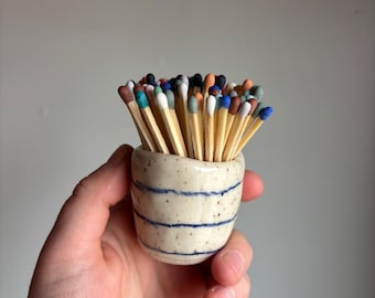 Blue striped match holder with rainbow hand dipped matches