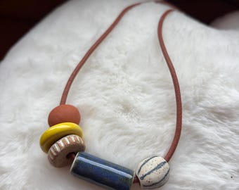 Leather necklace with handmade ceramic beads