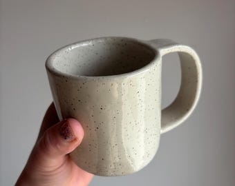 Strap handle mug with almond white glaze