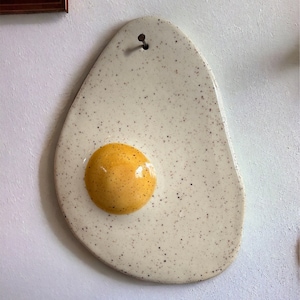 Oeuf sur un ongle art mural