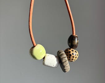 Leather necklace with handmade ceramic beads