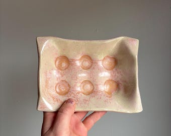 Pink egg holder with floral bottom