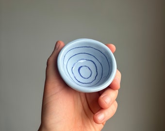 Tiny pinch pot dish with blue stripes