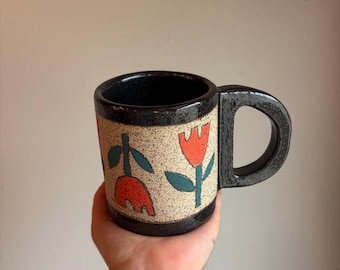 Sparkly black stoneware mug with matte tulips