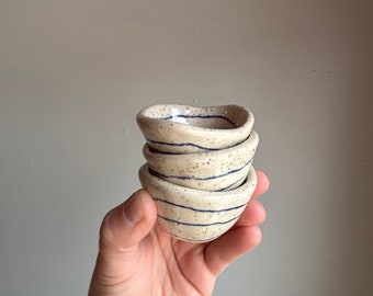 Tiny pinch pot dish with blue stripes