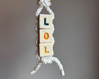 Oversized LOL letter bead wall hang