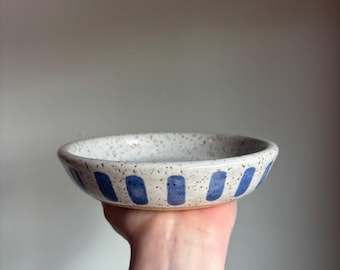 Shallow ceramic bowl with stripes