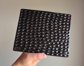 Textured ceramic butter board with black sparkle glaze