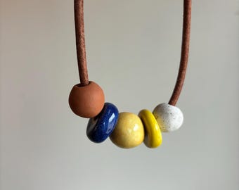 Leather necklace with handmade ceramic beads