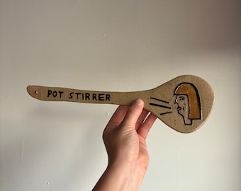 Pot stirrer with blonde hair