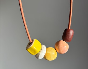 Leather necklace with handmade ceramic beads