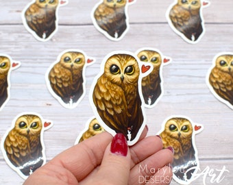 Cute owl vinyl sticker, cute little owl with a heart by Marylou Deserson