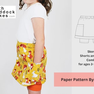 May include: A paper pattern for a skort, which is a combination of shorts and a skirt. The pattern is for ages 3-10 years. The image shows a child wearing a skort with a white shirt and a yellow and orange print. The text on the image reads "Skort Shorts and Skirt Combo for ages 3-10 years" and "Paper Pattern By Post".
