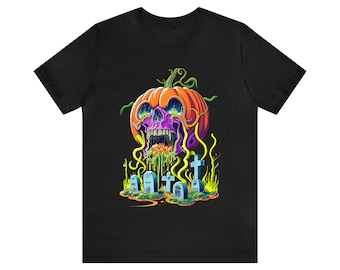 May include: A black t-shirt with a graphic of a pumpkin with a skull face and green goo dripping from its mouth. The pumpkin is surrounded by tombstones and crosses.
