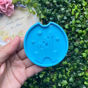 May include: Blue silicone mold shaped like a castle with stars. The mold is perfect for making resin crafts.