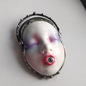 Creepy brooch doll face horror jewelry