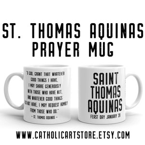 Peut inclure: Une tasse en céramique blanche avec une citation noire de Saint Thomas d'Aquin. La citation dit : "Ô Dieu, accorde que tout ce que j'ai de bon, je puisse le partager généreusement avec ceux qui n'ont rien. Et tout ce que je n'ai pas de bon, je puisse le demander humblement à ceux qui le font." La tasse présente également le texte "Saint Thomas d'Aquin" et "Fête le 28 janvier".
