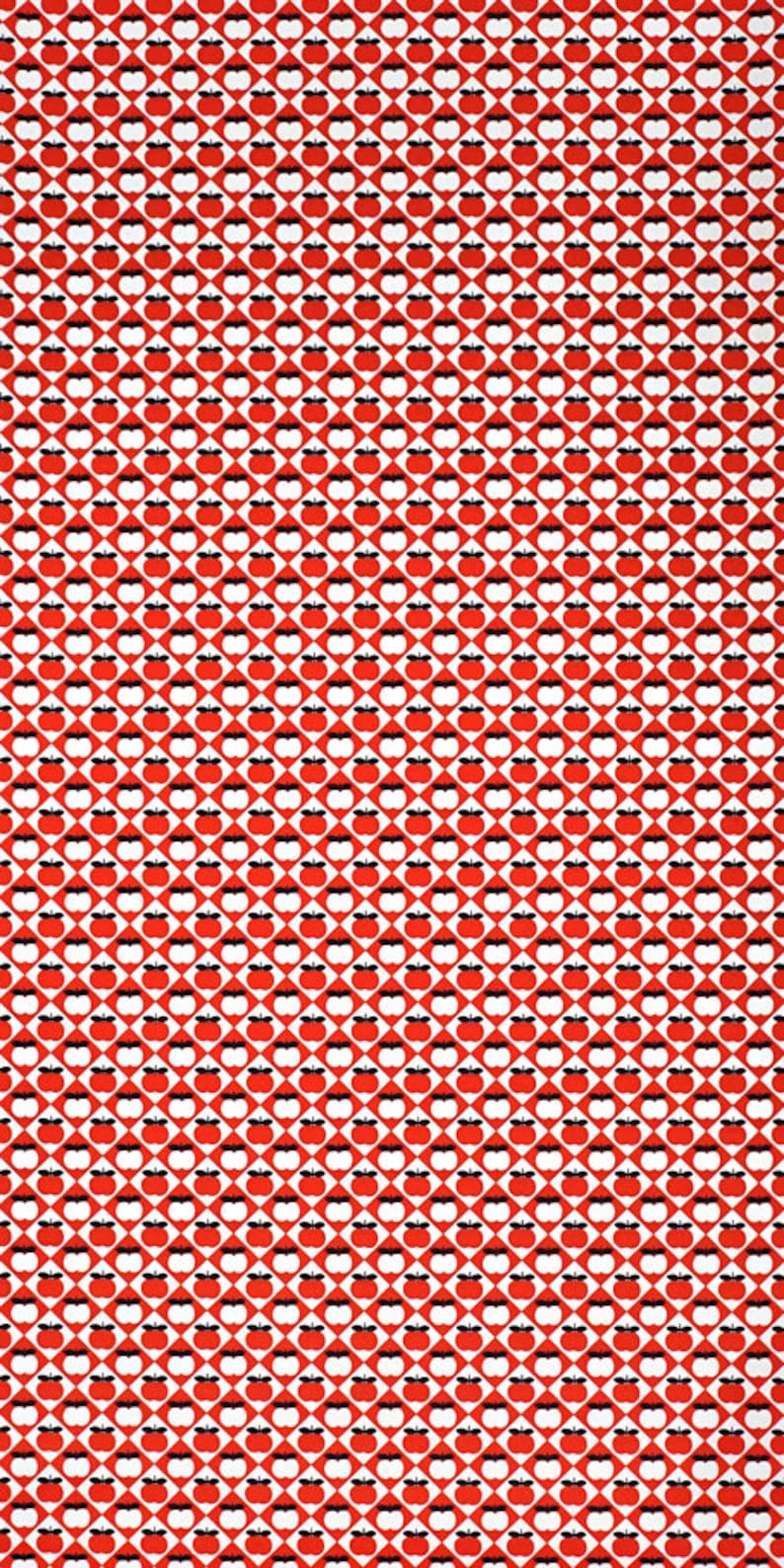 May include: Red and white fabric with a repeating pattern of black apples. The apples are arranged in a diamond pattern.