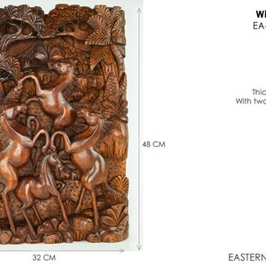 May include: A wooden wall sculpture depicting wild horses running through a forest. The sculpture is 32 cm wide and 48 cm tall. It is 7 cm thick and includes two wall hooks.