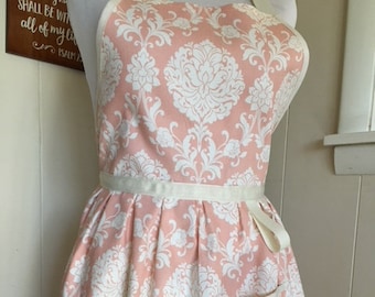 Bib Apron, pale peach with cream design and trim, made to cover fuller figures that enjoy cooking