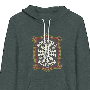 May include: A dark green hooded sweatshirt with a graphic print of a vintage-style logo. The logo is a red, yellow, and white shield with the text "Never Miss A Billy Show" inside.