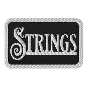 May include: White embroidered patch with a black background and the word "STRINGS" in a stylized font.